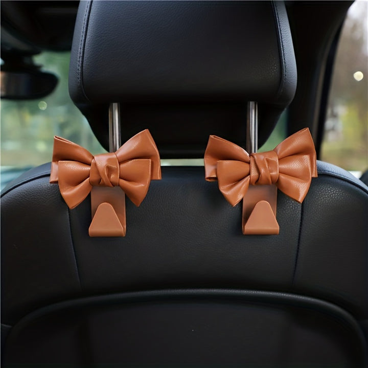 2pc Stylish PU Leather Car Hooks with Bow Tie - Perfect for Seat Headrest Organization and Auto Fastener Hangers - Enhance Your Car Storage