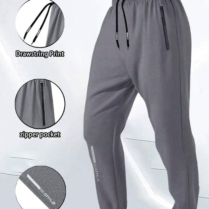 Gray men's ankle-zip sweatpants with drawstring, zipper pocket, and cuff print