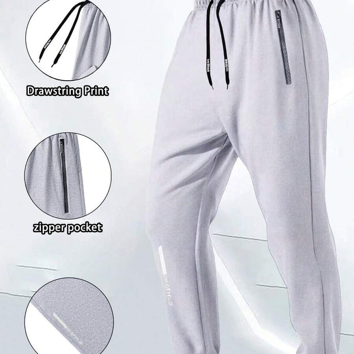 White ankle-zip sweatpants with drawstring, zipper pocket, and cuff print 