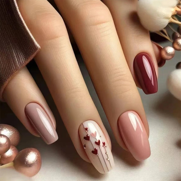 A full set of 24 long coffin-shaped fake nails with solid color fake nails and a heart design, including 1 jelly glue and 1 rub